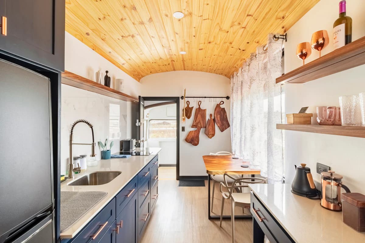 Kitchen with timber ceiling and open shelves