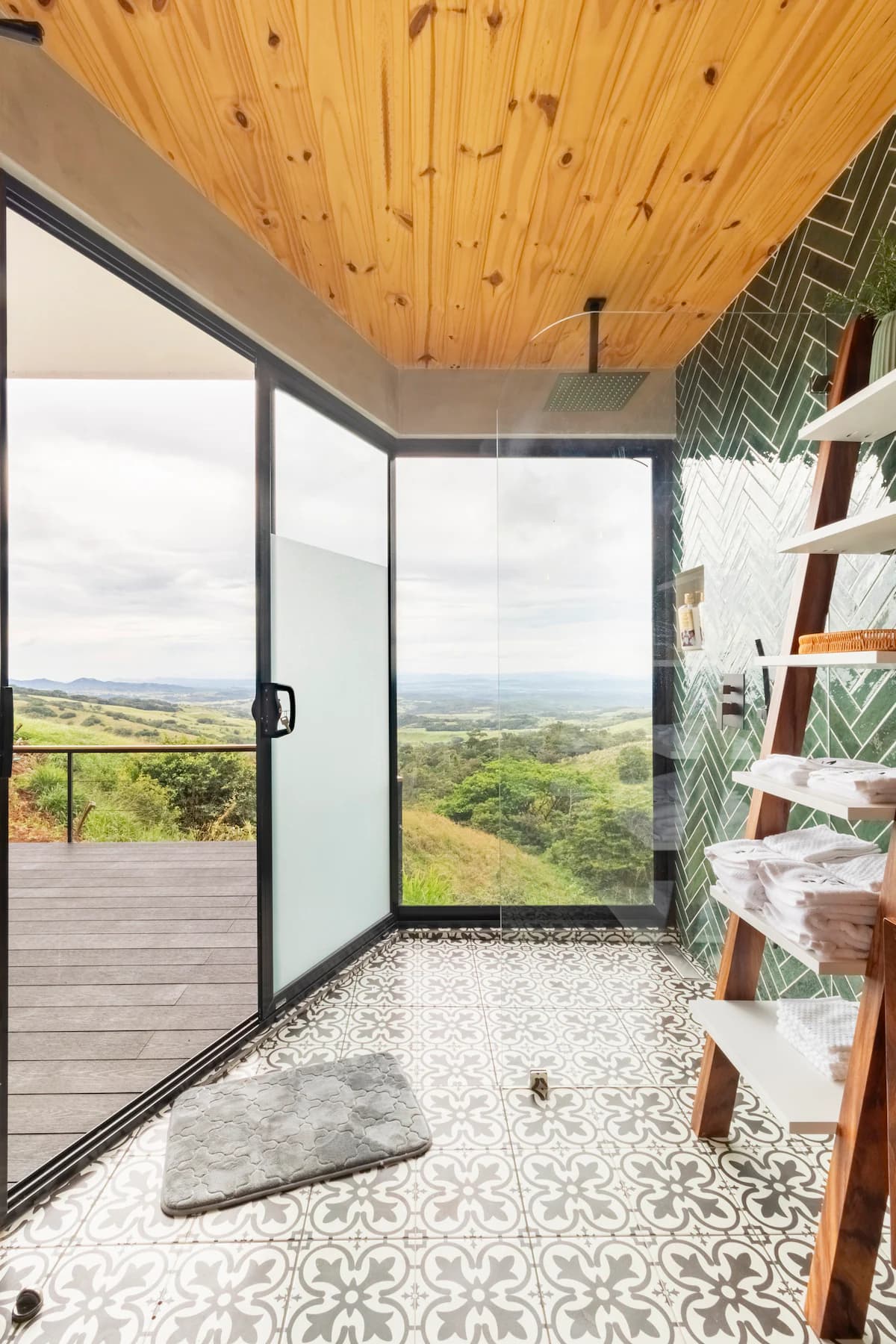 Glass-walled shower facing the valley