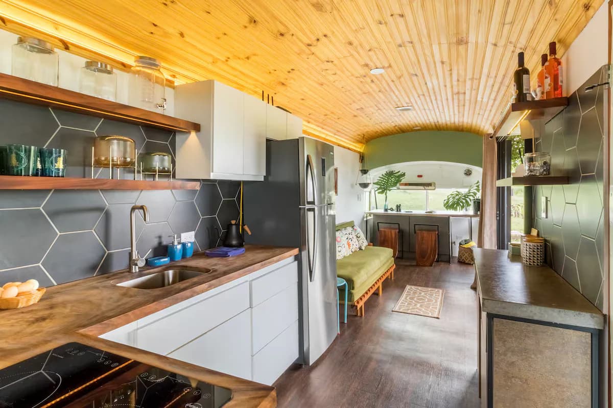 Kitchen with hardwood counters and tiled backsplash