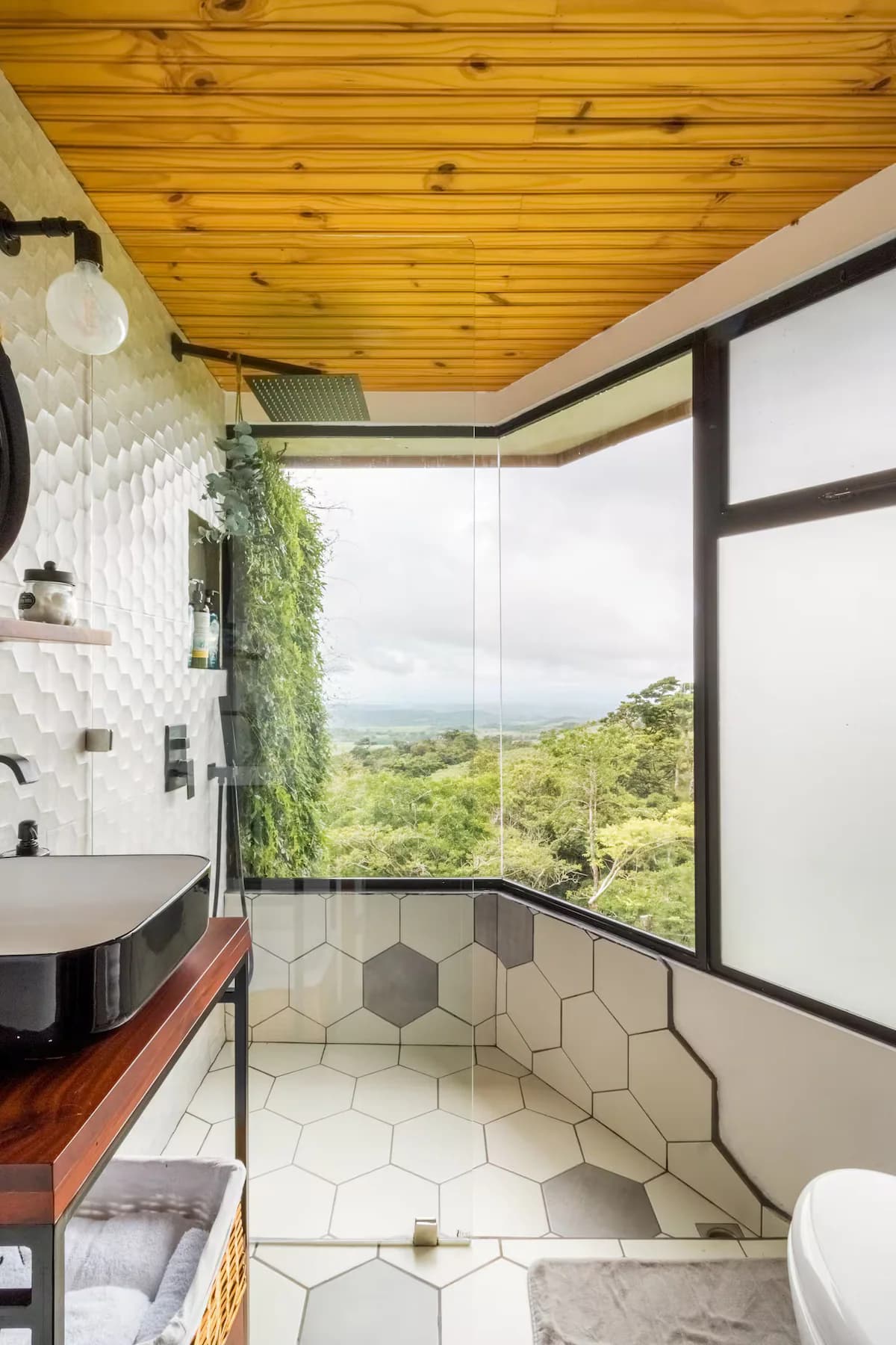 Bathroom with hexagon tiles and a valley window