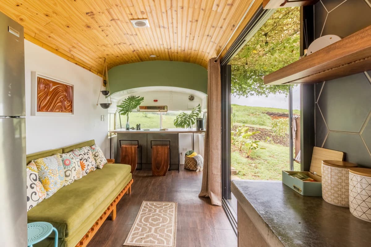 Living area with sofa bed and timber ceiling